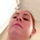 A woman records herself from a rear position as she takes a hard, chunky shit into a toilet. Excatly a minute.